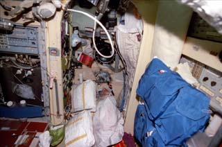 Various views of stowage bags, hardware and personal items in the Mir space station Base Block (sleeping quarters).